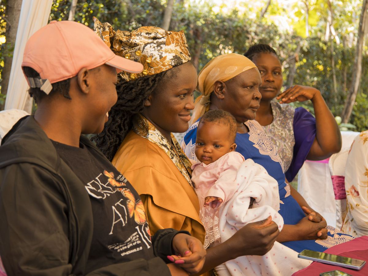 Women and a baby seated together